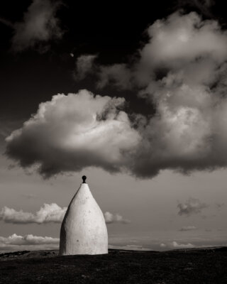 White Nancy, clouds and waxing gibbous moon