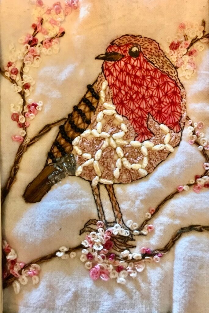 A robin in stitches.